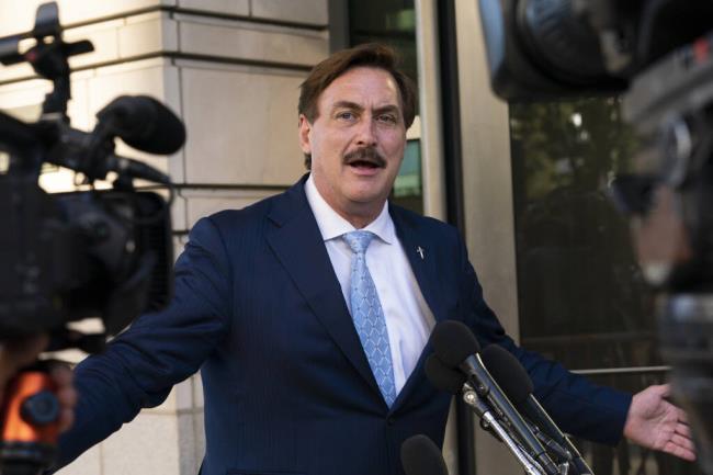 FILE - MyPillow chief executive Mike Lindell speaks to reporters outside federal court in Washington, Thursday, June 24, 2021. On Tuesday, Sept. 13, 2022, Lindell said that federal agents seized his cellphone and questio<em></em>ned him a<em></em>bout a Colorado clerk who has been charged in what prosecutors say was a “deceptive scheme” to breach voting system technology used across the country. (AP Photo/Manuel Balce Ceneta, File)