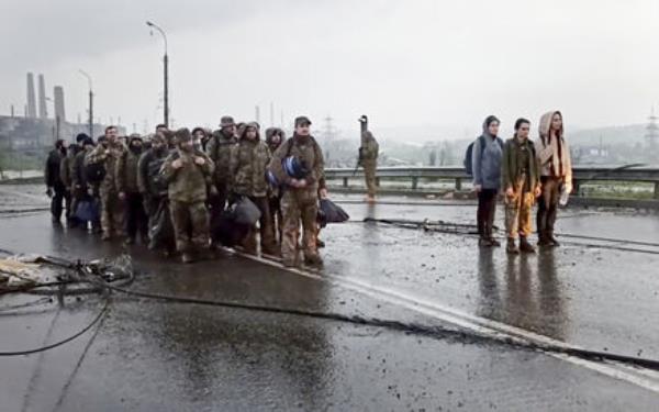 A photo, taken from video released by the Russian Defense Ministry, shows Ukrainian servicemen as they leave the besieged Azovstal steel plant in Mariupol. Picture: Russian Defense Ministry Press Service via AP