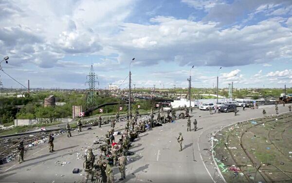 In this photo taken from video released by the Russian Defense Ministry on Saturday, May 21, 2022, Ukrainian servicemen line up to be checked as they leave the besieged Azovstal steel plant in Mariupol, in territory under the government of the Do<em></em>netsk People's Republic, eastern Ukraine. . Picture: Russian Defense Ministry Press Service via AP