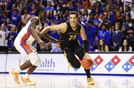 GAINESVILLE, FLORIDA - NOVEMBER 18: Patrick Baldwin Jr. #23 of the Milwaukee Panthers drives to the basket against Anthony Duruji #4 of the Florida Gators during the first half of a game at the Stephen C. O'Co<em></em>nnell Center on November 18, 2021 in Gainesville, Florida. (Photo by James Gilbert/Getty Images)