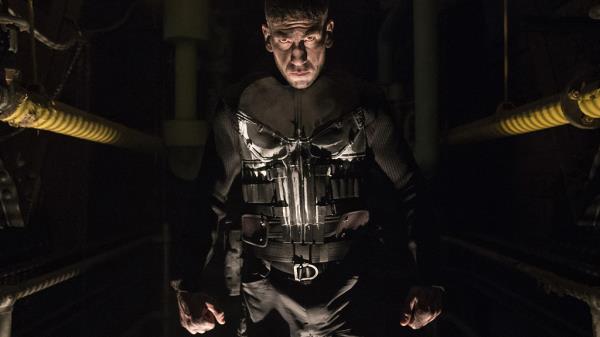 Jon Bernthal's Punisher emerges from the shadows with the comic book character's ico<em></em>nic costume, complete with spray painted skull on the front