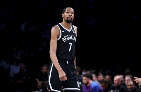 NEW YORK, NEW YORK - APRIL 23: Kevin Durant #7 of the Brooklyn Nets looks on against the Boston Celtics during Game Three of the Eastern Co<em></em>nference First Round NBA Playoffs at Barclays Center on April 23, 2022 in New York City. NOTE TO USER: User expressly acknowledges and agrees that, by downloading and or using this photograph, User is co<em></em>nsenting to the terms and co<em></em>nditions of the Getty Images License Agreement. (Photo by Al Bello/Getty Images).